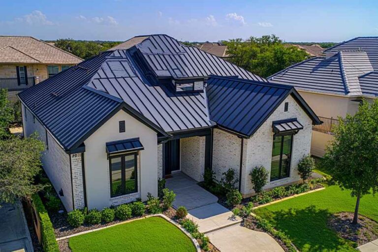 Modern house with dark roof and garden.