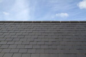 Close-up of natural slate shingles on a newly installed roof in Tomball